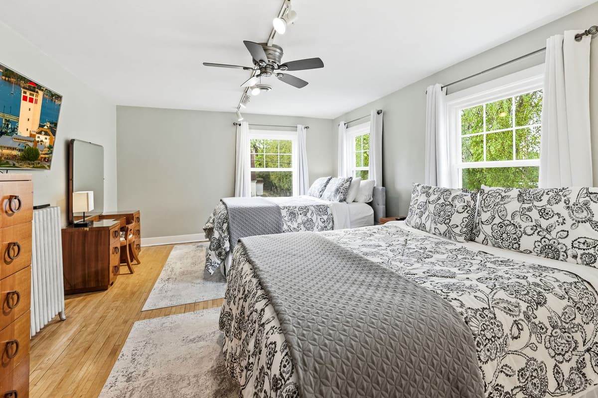This spacious bedroom features two comfortable queen beds, making it a great option for families or groups traveling together.