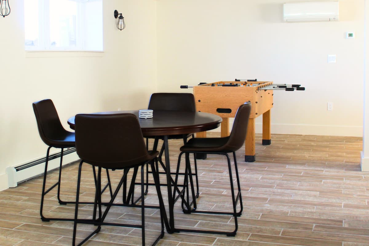 The foosball table adds a fun way to challenge family and friends to a friendly match.