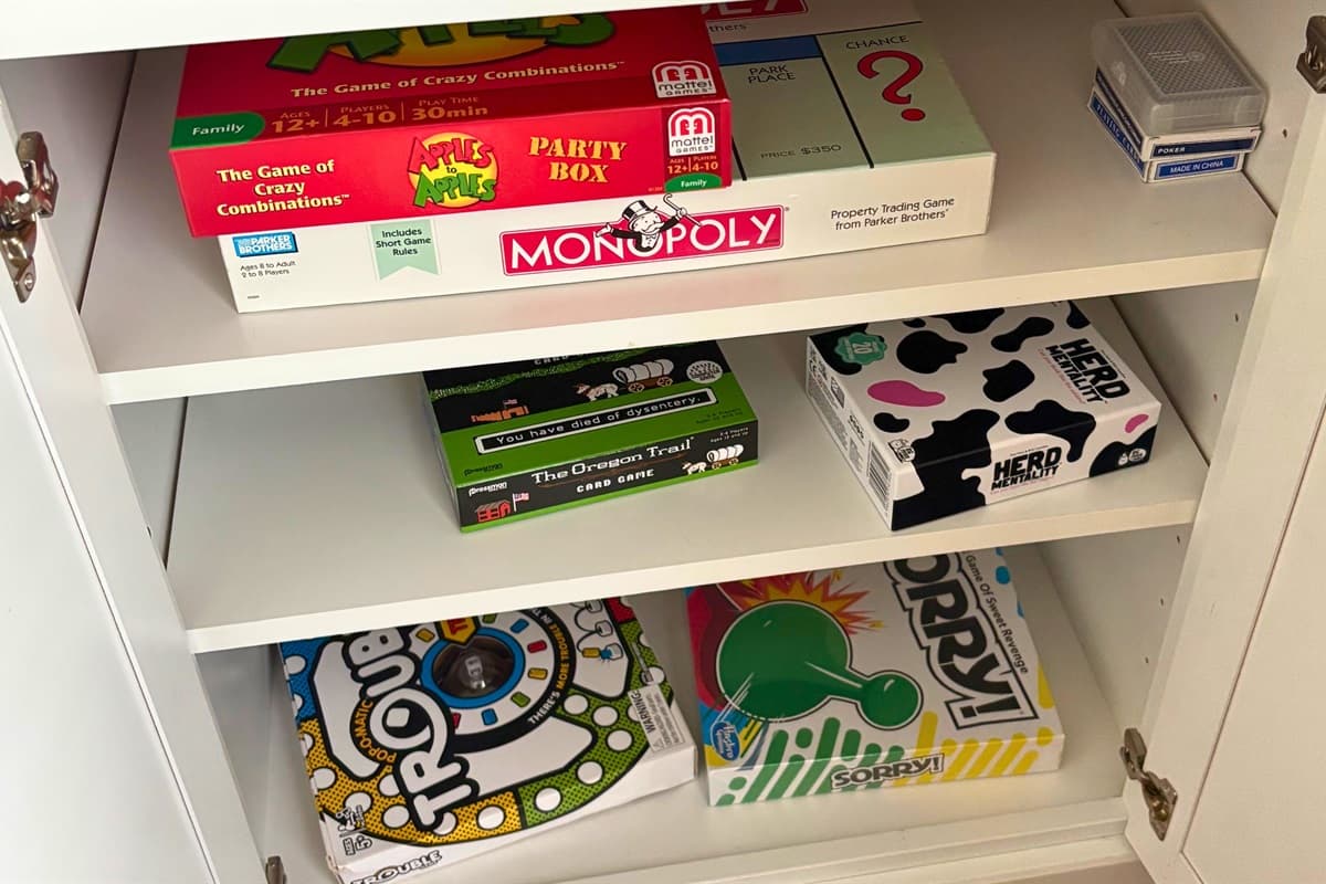 A selection of board games, including classics like Monopoly, Chutes and Ladders, and more, perfect for cozy evenings in.