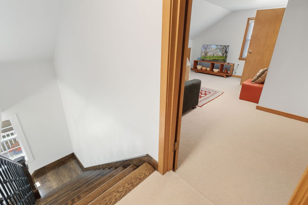 Head upstairs to discover even more space to relax and settle in.