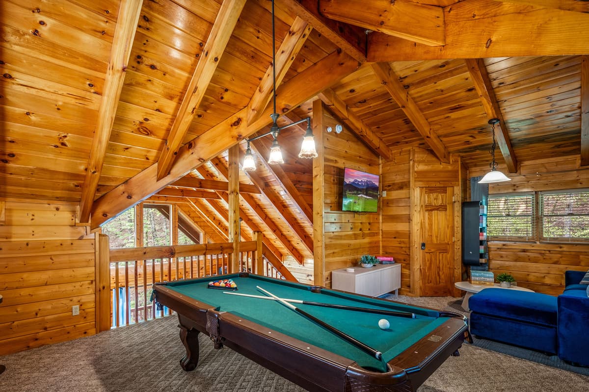 Head upstairs and let the fun begin!  The upstairs game room is ready for a little friendly competition, featuring a billiard table that’s perfect for game nights and good times.