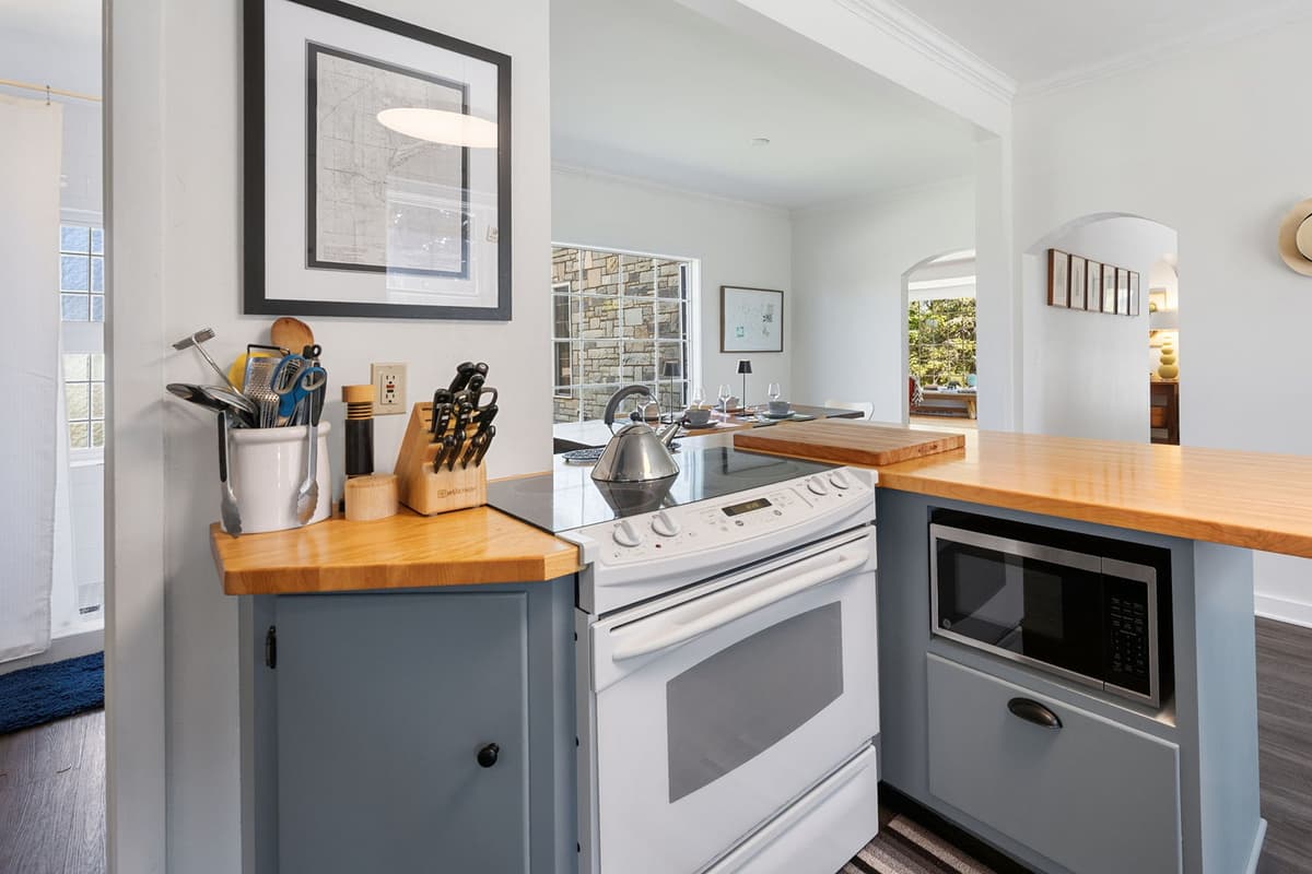 Well-appointed appliances blend seamlessly with the warm farmhouse style.
