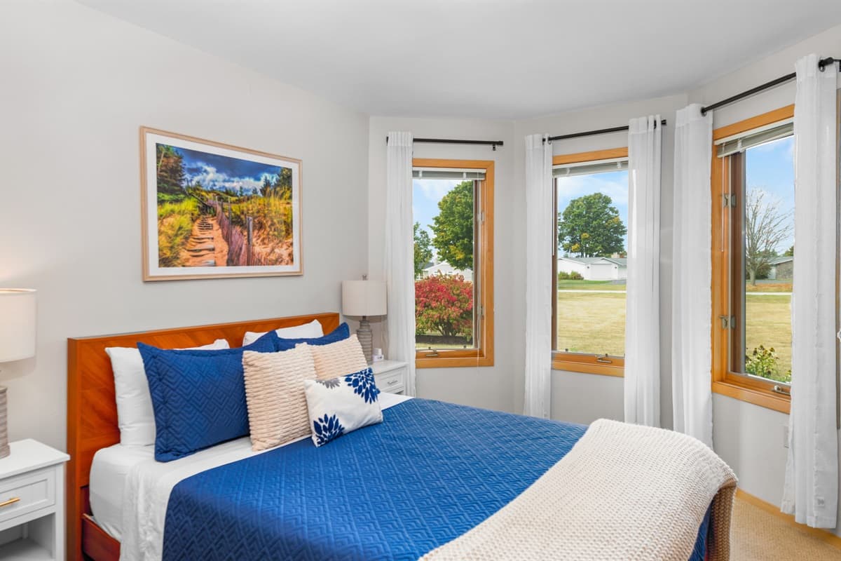 Large windows fill the room with natural light and offer lovely views.