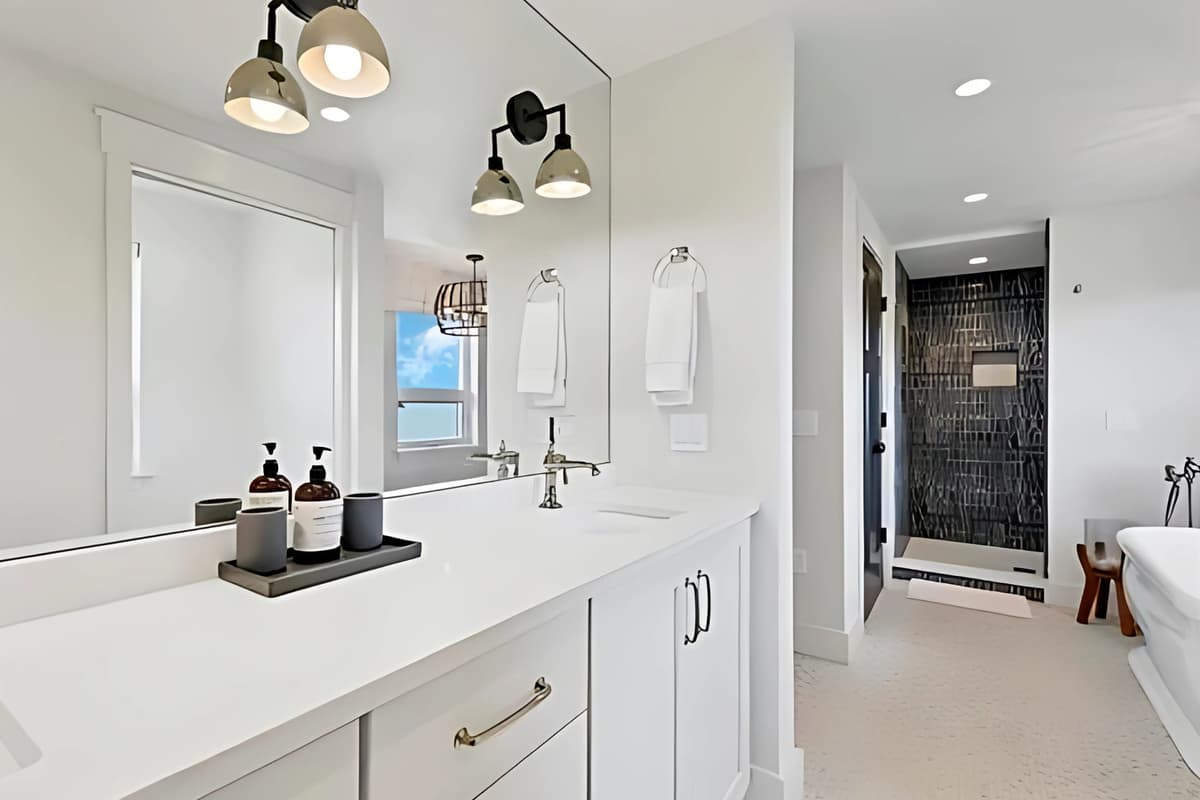 The spacious master bathroom offers a beautiful blend of comfort and convenience.
