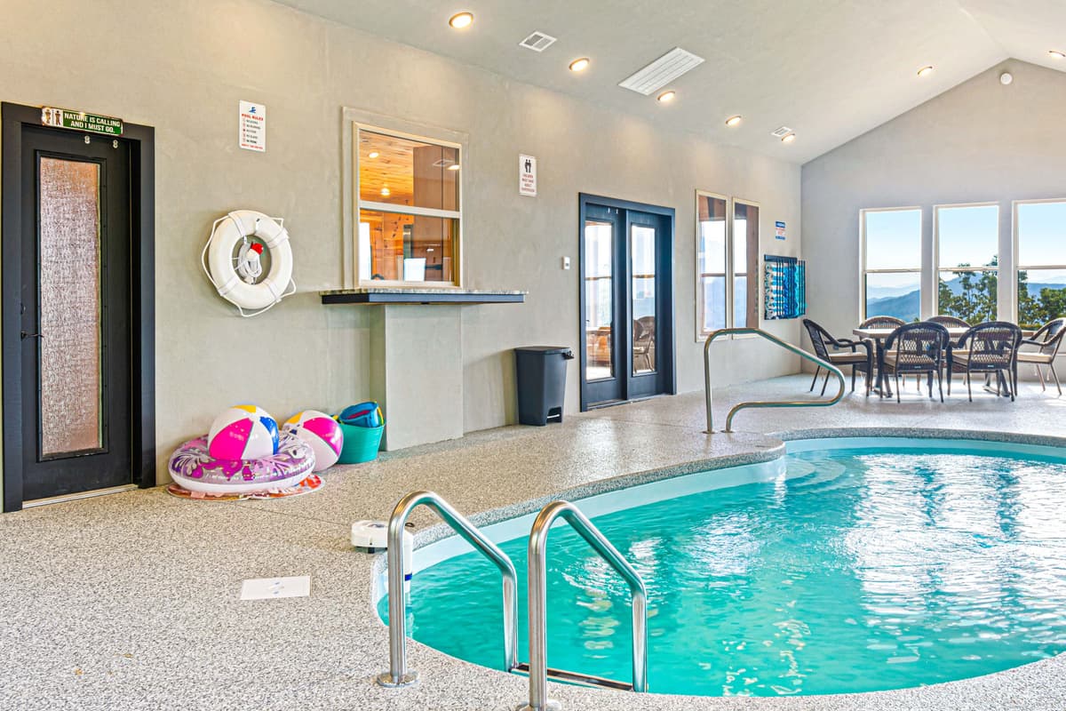 The main level offers an exciting blend of comfort and entertainment, featuring a private indoor heated pool for year-round enjoyment.