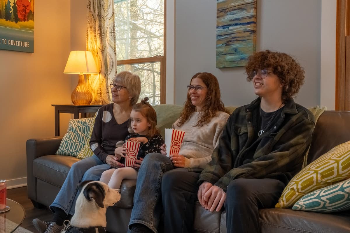 Curl up on the comfortable seating and enjoy your favorite shows on the TV.