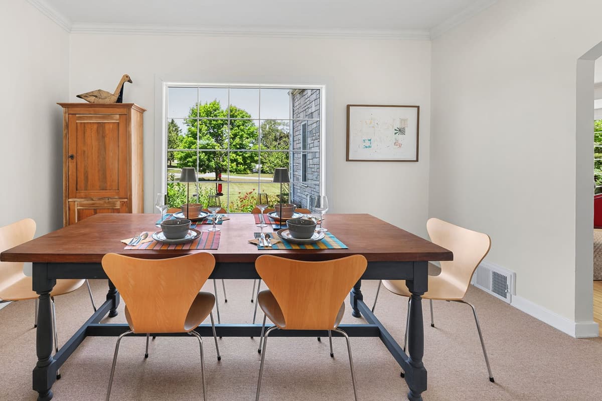 Large windows fill the dining area with natural light and offer a bright, inviting setting for every meal.