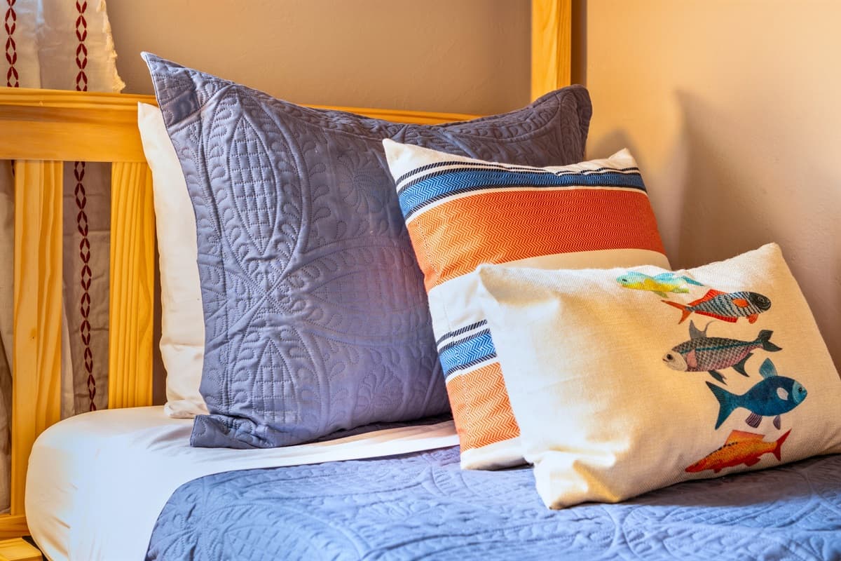 Soft linens and a cozy setup make it a comfortable spot to rest after a day of adventures.