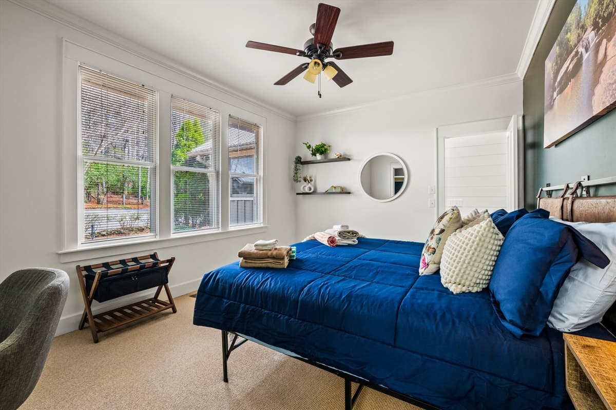 Bright Third Bedroom with Queen Bed, Ceiling Fan and Natural Light