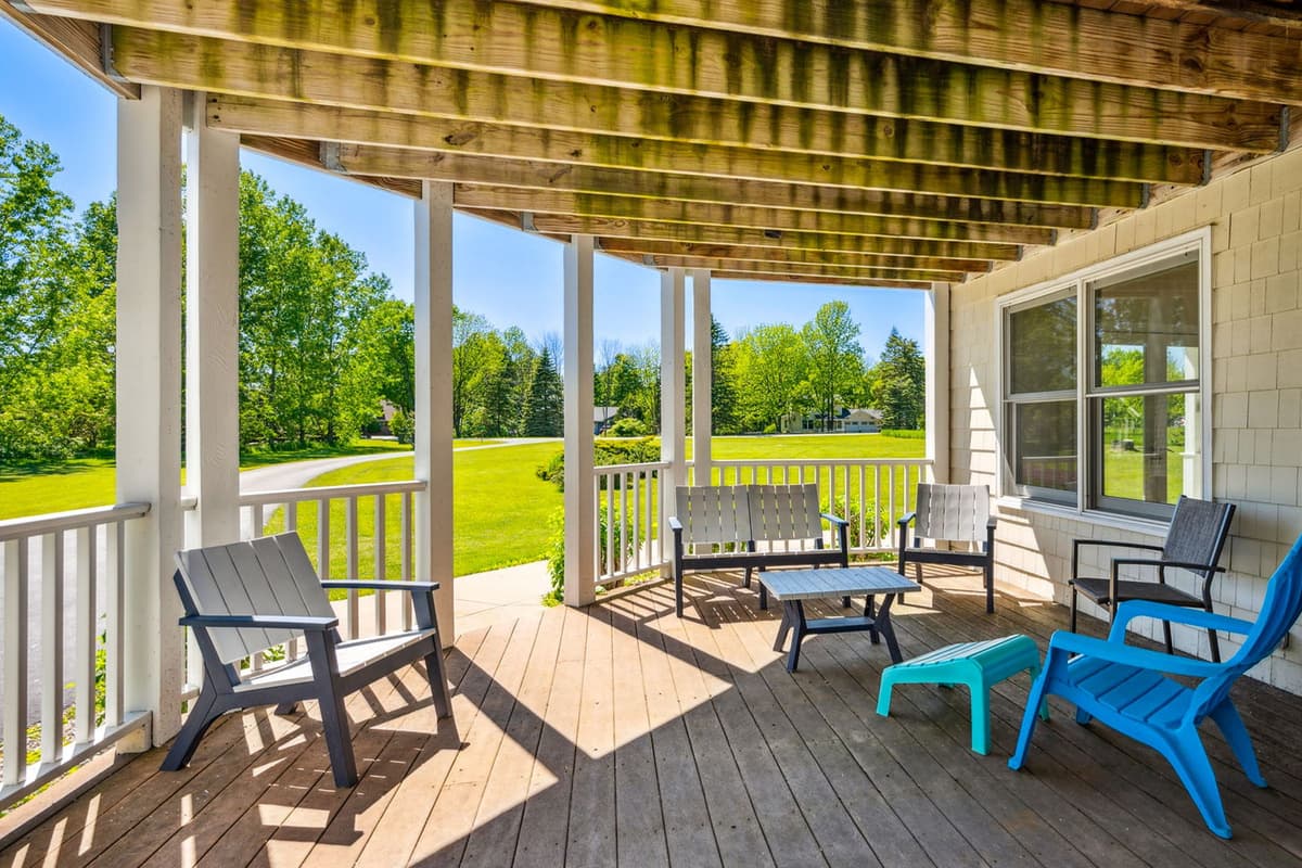 Comfortable seating provides a cozy spot to relax before heading inside.