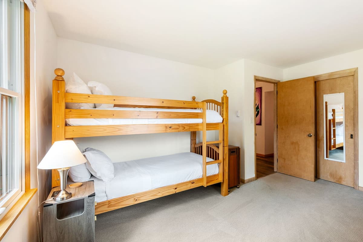 The bunk arrangement adds flexibility for families and friends traveling together.