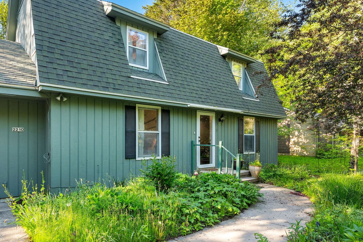 Enjoy the peaceful beauty of nature with lush greenery surrounding the property.