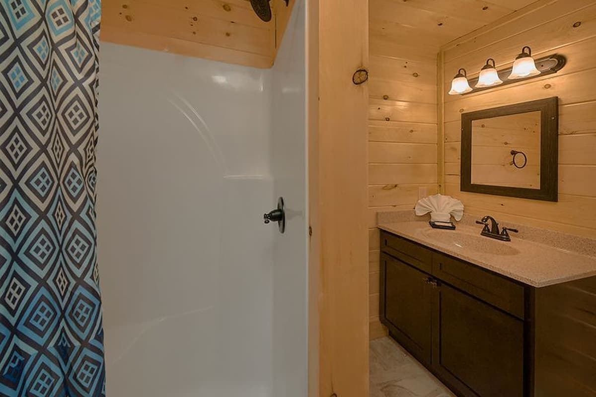 Refresh and recharge in this clean, comfortable bathroom, perfect for getting ready for your Smoky Mountain adventures.