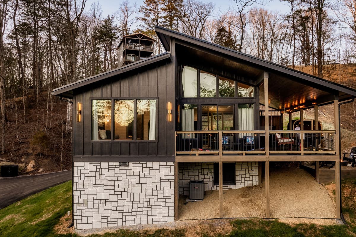 The side views of Falcon Crest showcase the cabin’s charming mountain-style exterior and peaceful surroundings.