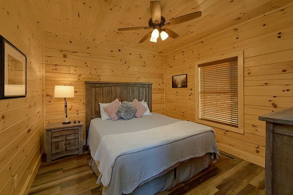 Unwind in another cozy king bedroom, perfect for relaxing after a day of Smoky Mountain adventures. The spacious king bed offers a comfortable place to stretch out and recharge.