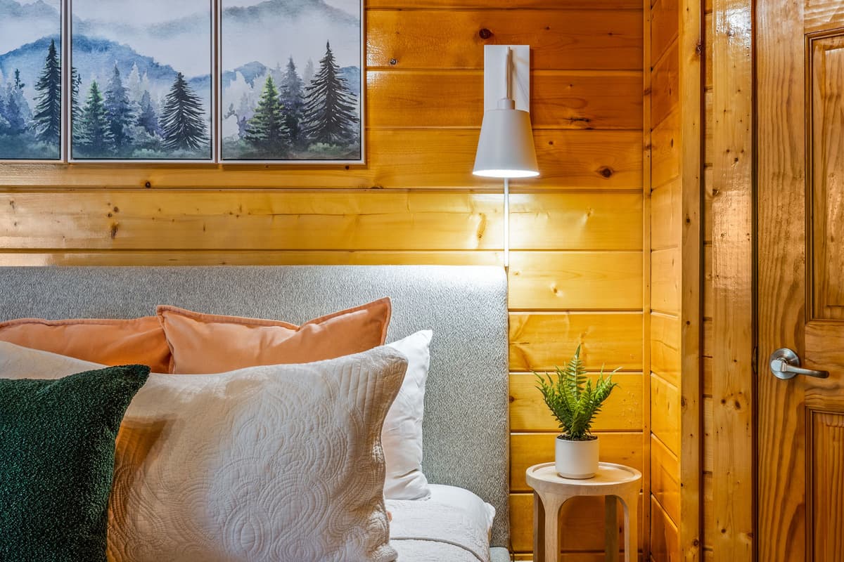 This charming bedroom invites relaxation with its comfortable bed, soft textiles, and tasteful decor, providing a serene haven for your stay.