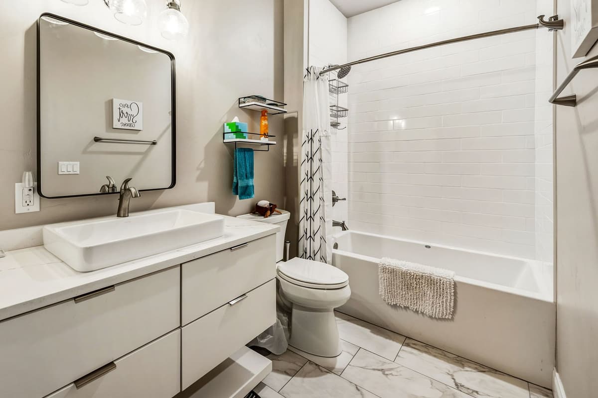 Spacious full bathroom with a clean and comfortable design.