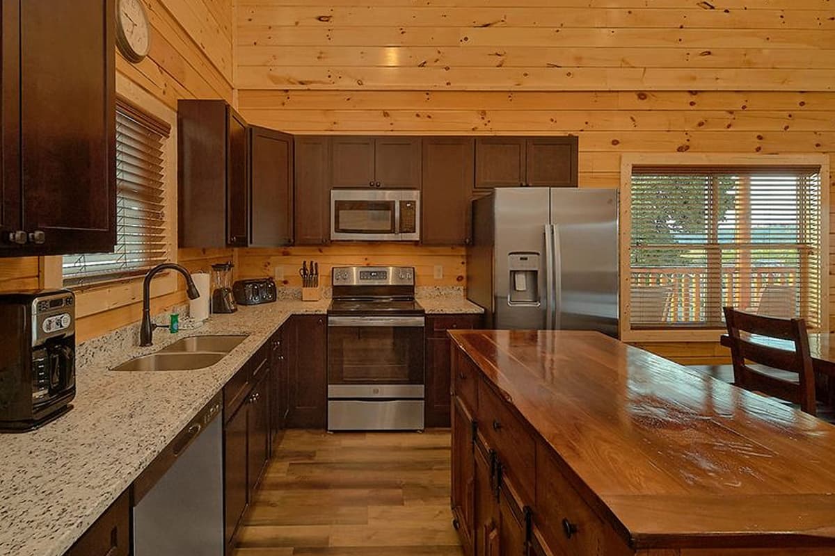 Stainless steel appliances add a modern touch to this inviting space. Prepare everything from quick breakfasts to delicious family dinners with ease.