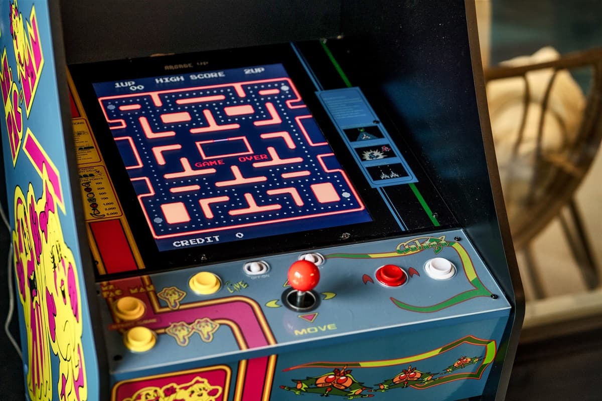 This vibrant arcade game, showcasing the classic Pac-Man, invites guests to enjoy nostalgic entertainment and friendly competition. Its colorful design and engaging gameplay make it a fantastic addition to the entertainment area.