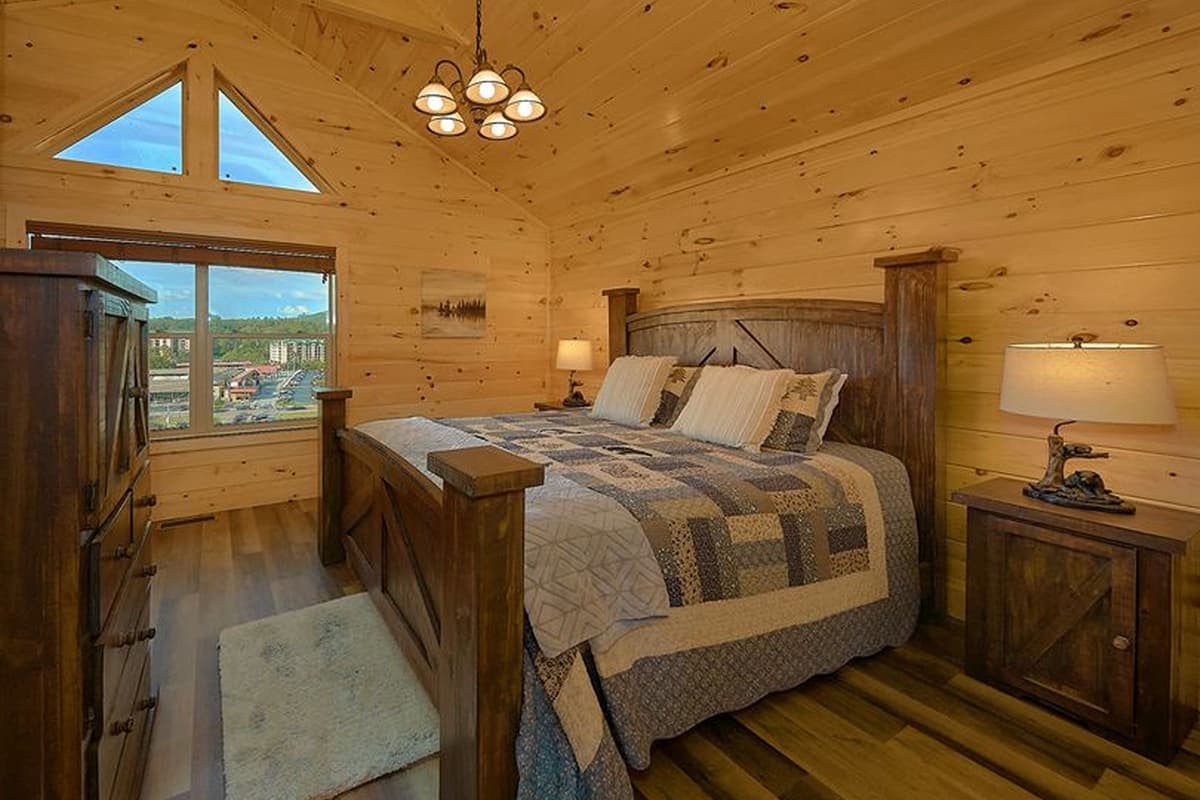 Rest easy in the cabin’s inviting king bedroom, designed for comfort and relaxation.The spacious king bed offers plenty of room to stretch out after a day of Smoky Mountain adventures.