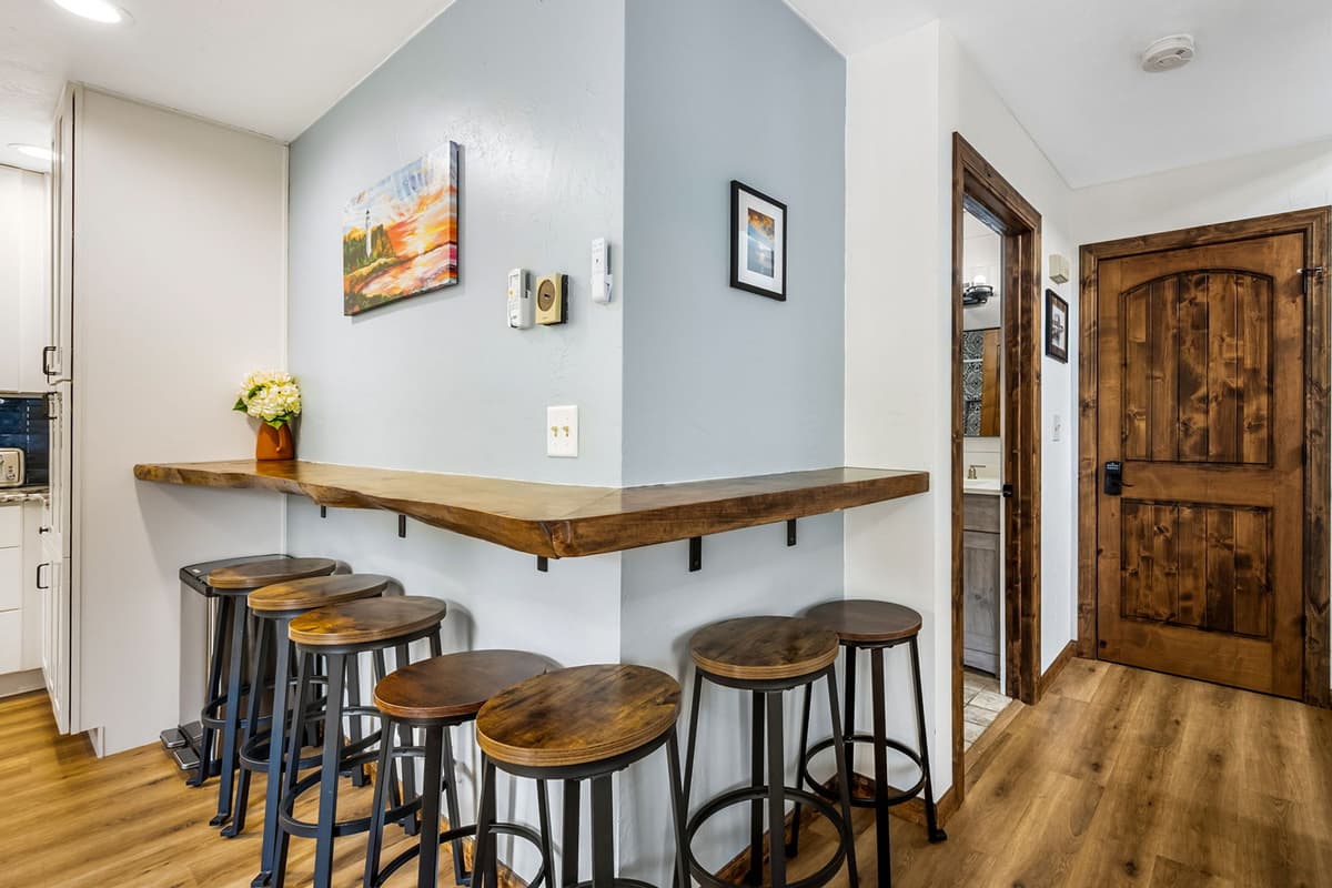 Additional bar seating provides extra space for guests to enjoy a quick breakfast, sip coffee, or gather while meals are being prepared.