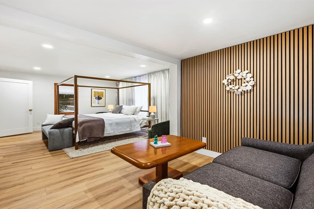 The spacious room also includes a cozy pullout sofa in the seating area, perfect for additional guests or simply lounging in comfort.