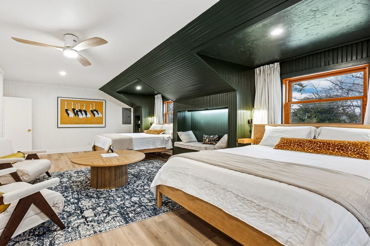 The other guest bedroom is ideal for families or friends, featuring two comfortable queen beds—perfect for kids or guests who want to share a space.