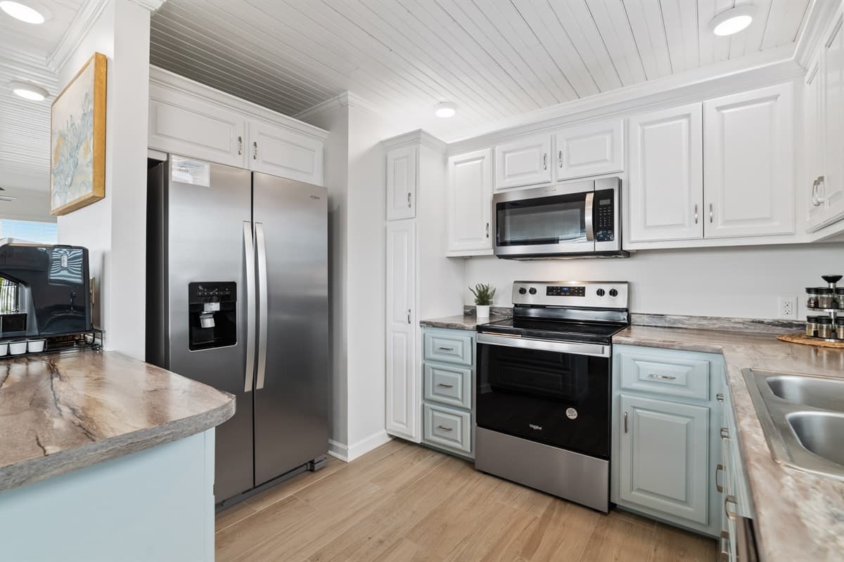 In our modern kitchen, sleek stainless steel appliances blend style and functionality