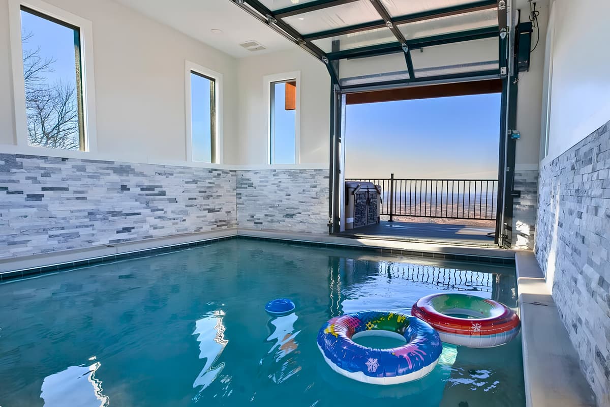 The enclosed pool area offers a comfortable place to swim and unwind, no matter the weather outside.