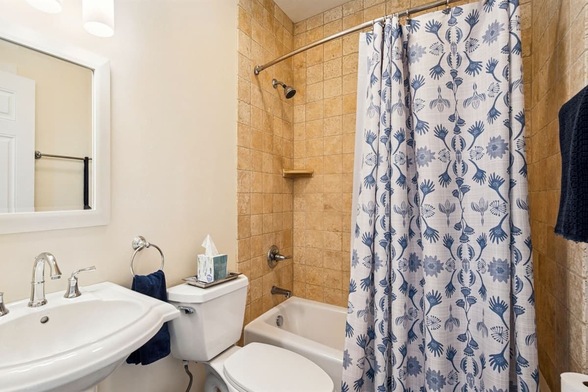 Bathroom features a versatile shower and tub combo.