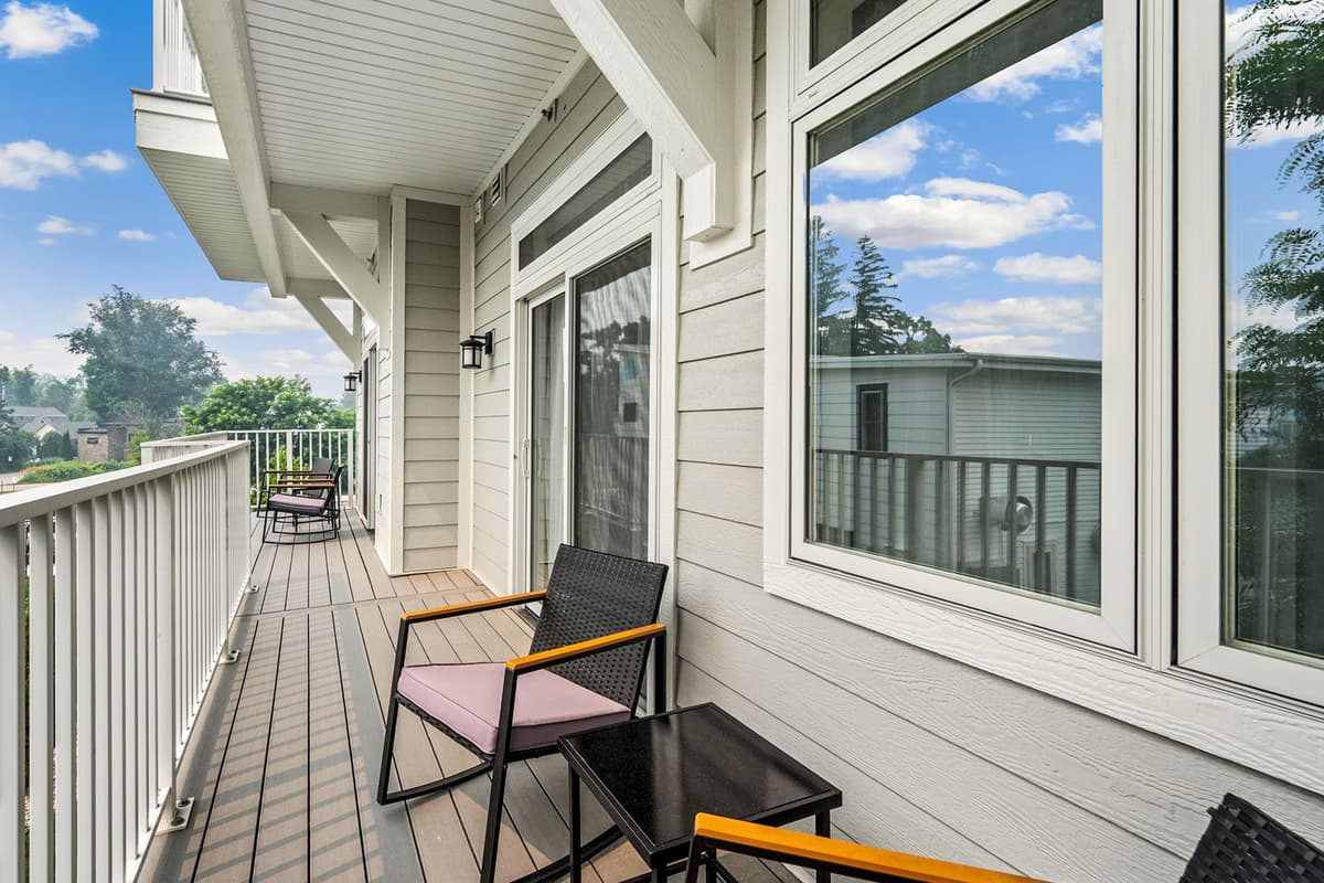 Step outside from the bedroom to enjoy the deck’s comfortable seating area and peaceful surroundings.