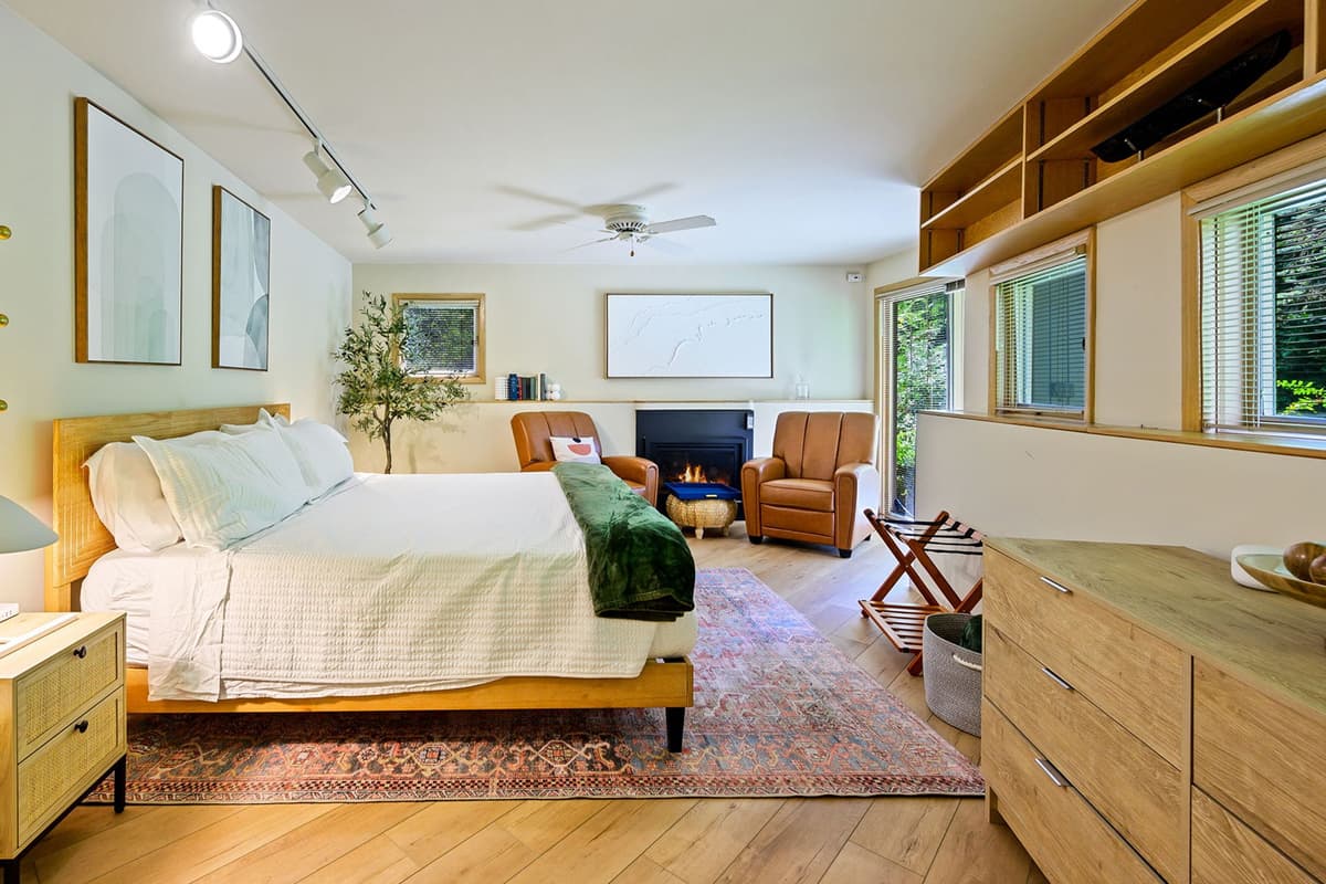 The spacious king bed provides a cozy place to rest and recharge.