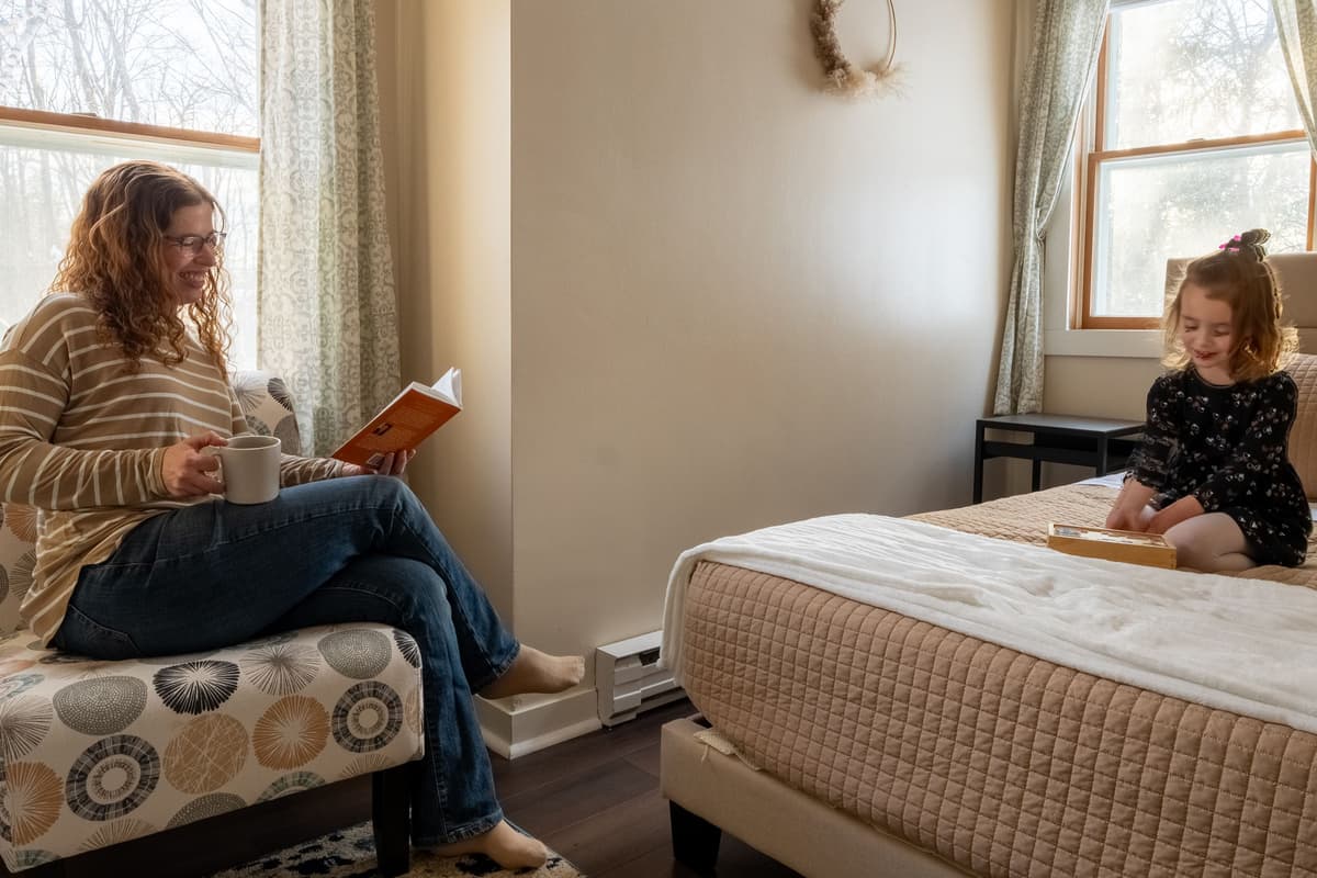 The plush queen-size bed offers a cozy place to unwind after a day of adventures.