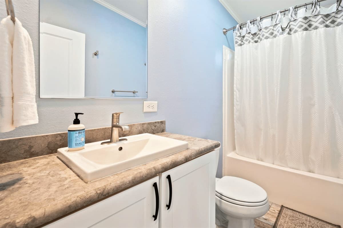 Step into our stylish bathroom retreat! Designed for relaxation, it offers a perfect escape with modern comforts and a soothing atmosphere.