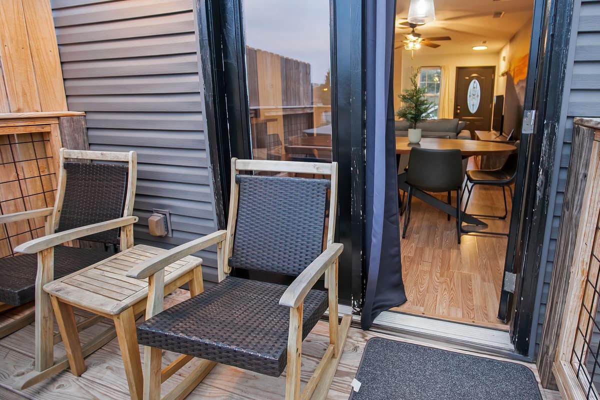 Step outside and enjoy the fresh mountain air from the private deck.
Comfortable outdoor seating provides a relaxing spot to unwind.
