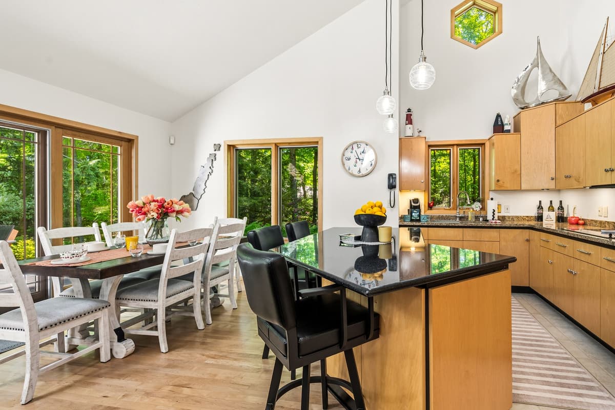 Spacious dining and kitchen space with an open, inviting layout, perfect for preparing meals, enjoying breakfast, and gathering together.