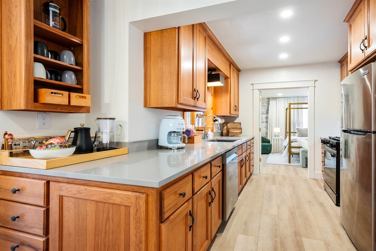 Thoughtfully designed with plenty of counter space, custom cabinetry, and modern finishes, the kitchen is both functional and beautiful.