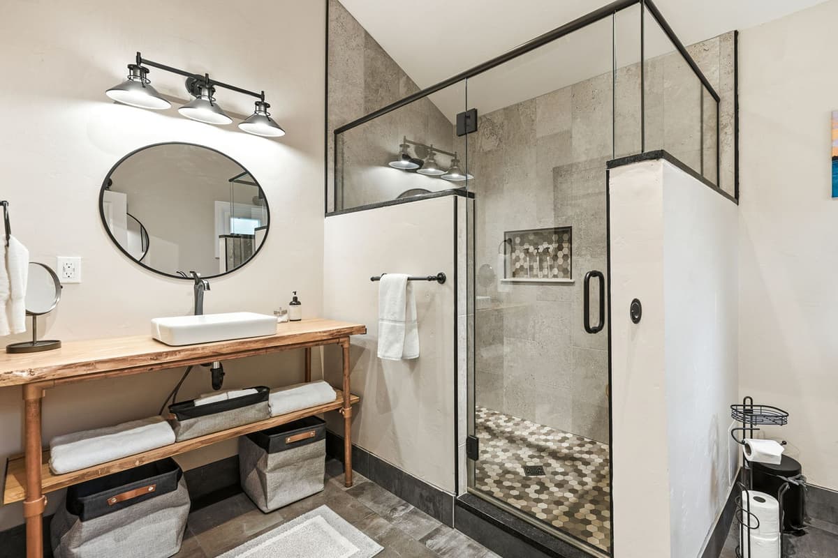 The walk-in shower adds a modern touch while making the bathroom easy and comfortable to use. It’s a relaxing and convenient addition to the private suite.