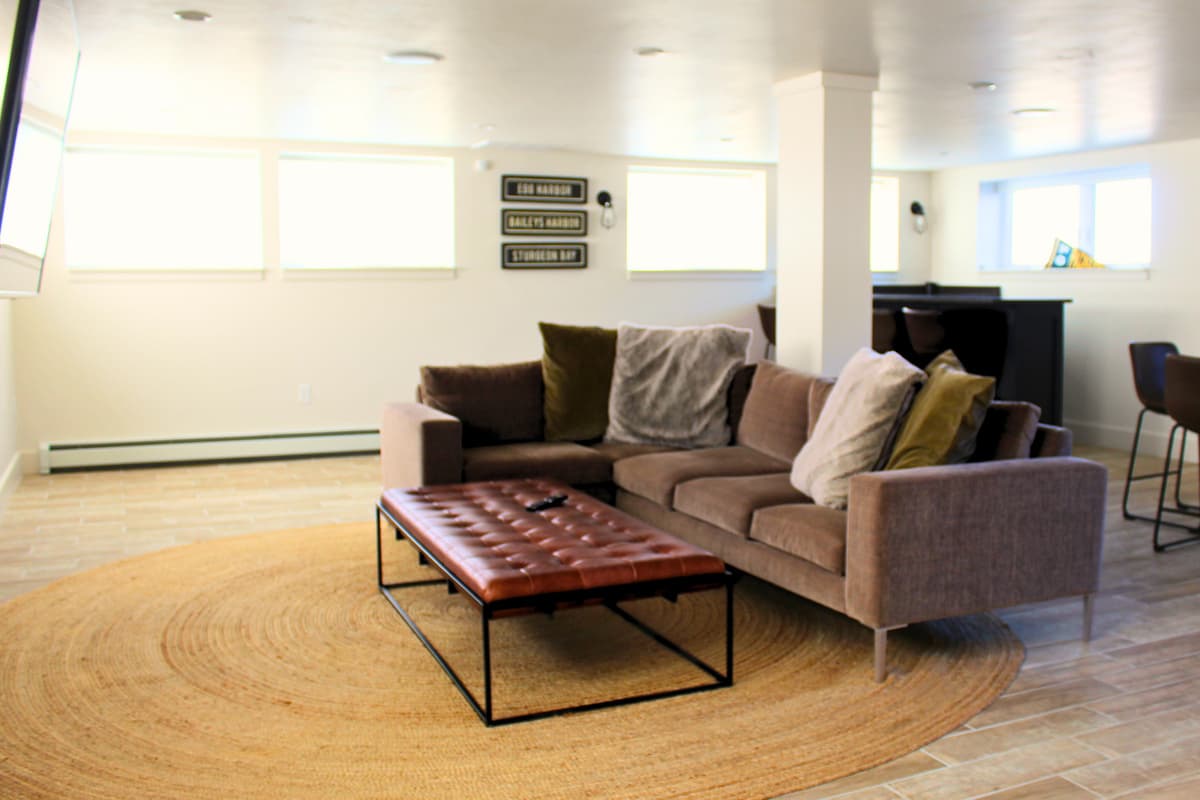 Relax on the comfortable seating and enjoy a favorite movie or show on the TV.
