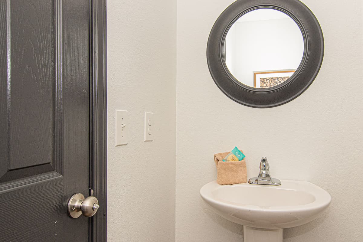 A convenient half bathroom is located off the main living area.