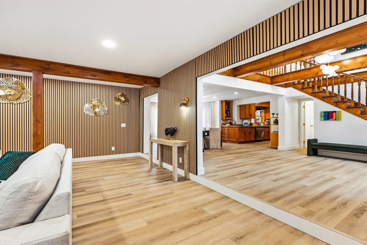 Adjacent to the living room is the dining area offering a spacious table for family gatherings or intimate dinners.