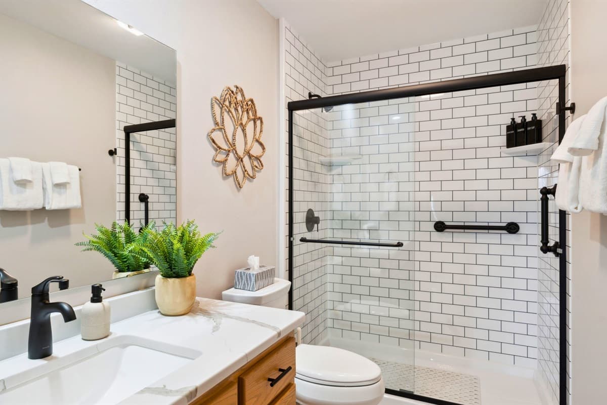 Modern and sleek, this bathroom features a spacious walk-in shower for a refreshing, spa-like experience.