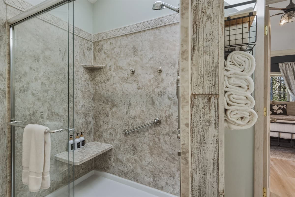 The walk-in shower adds a spacious and comfortable experience for guests, making it easy to unwind after exploring Door County.