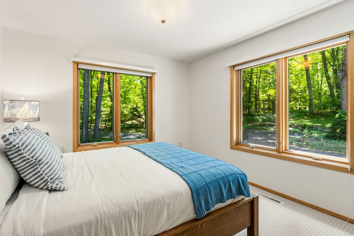 This additional queen bedroom offers a cozy and inviting space to relax and recharge.
Soft furnishings and a welcoming atmosphere create a peaceful retreat.