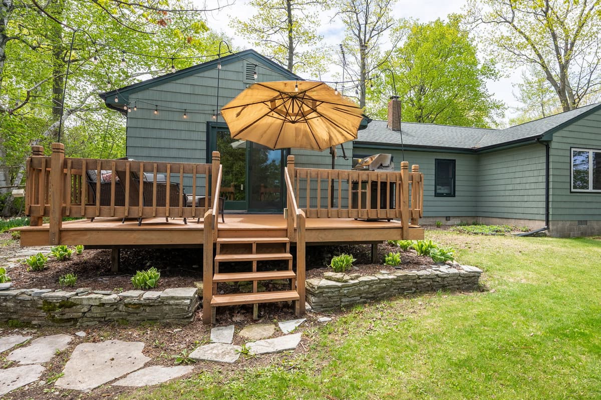 Enjoy the inviting outdoor patio, featuring comfortable space to relax and a convenient grill for outdoor cooking.