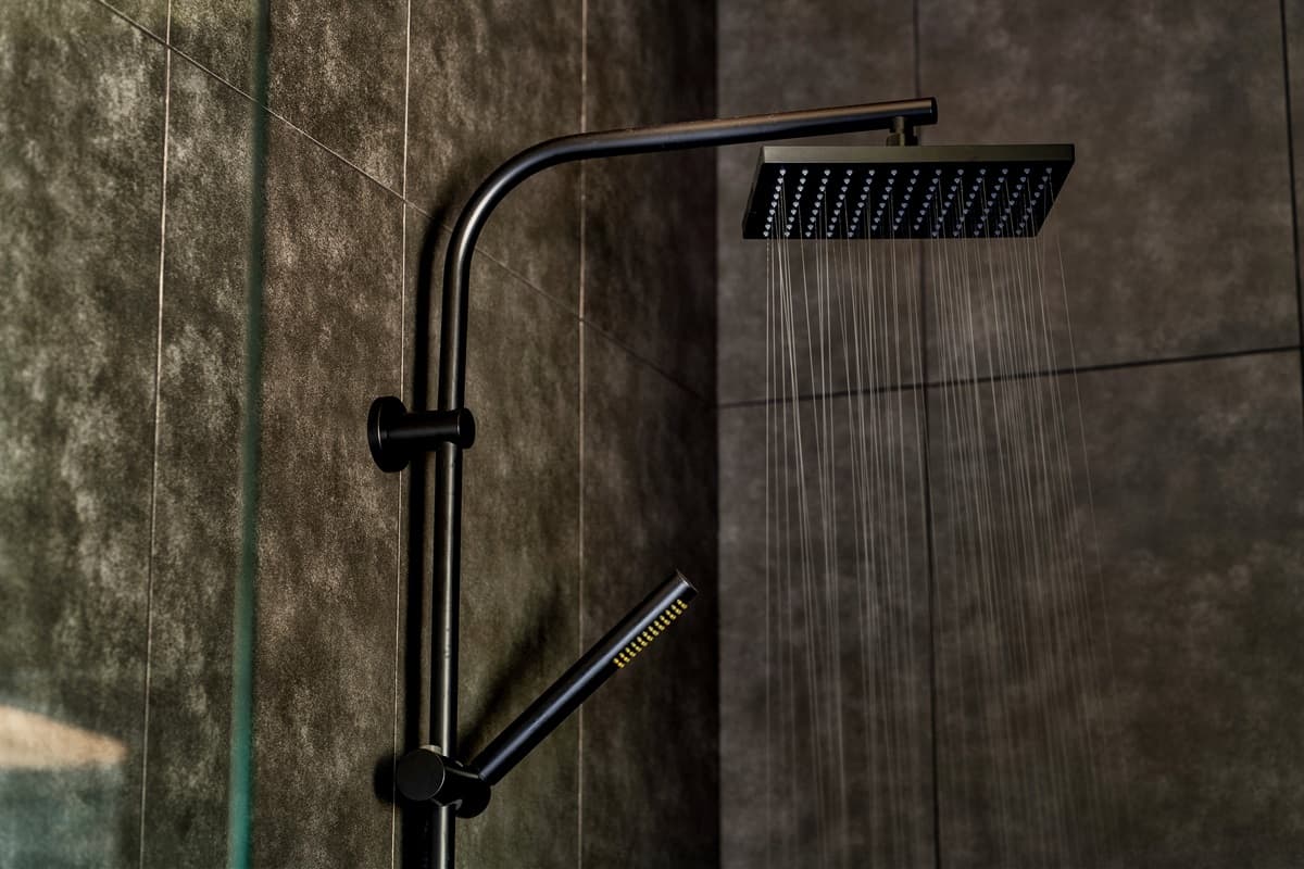 Enjoy a refreshing experience under the rainfall showerhead, offering a luxurious and modern bathing amenity.