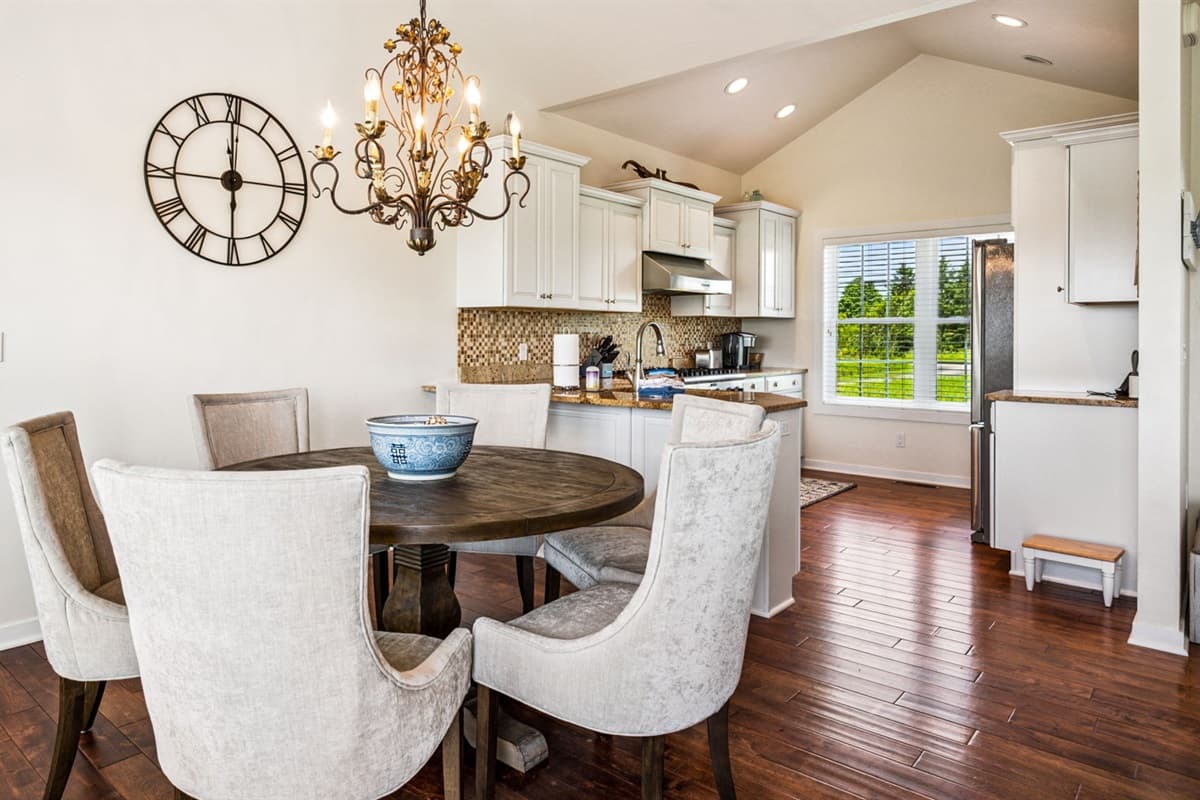 An open dining and kitchen space designed for gathering—easy flow, great conversation, and meals that turn into memories.