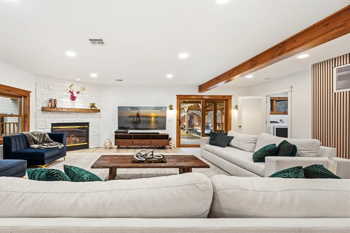 With natural wood beams and expansive windows, this space is infused with the timeless charm of Door County.