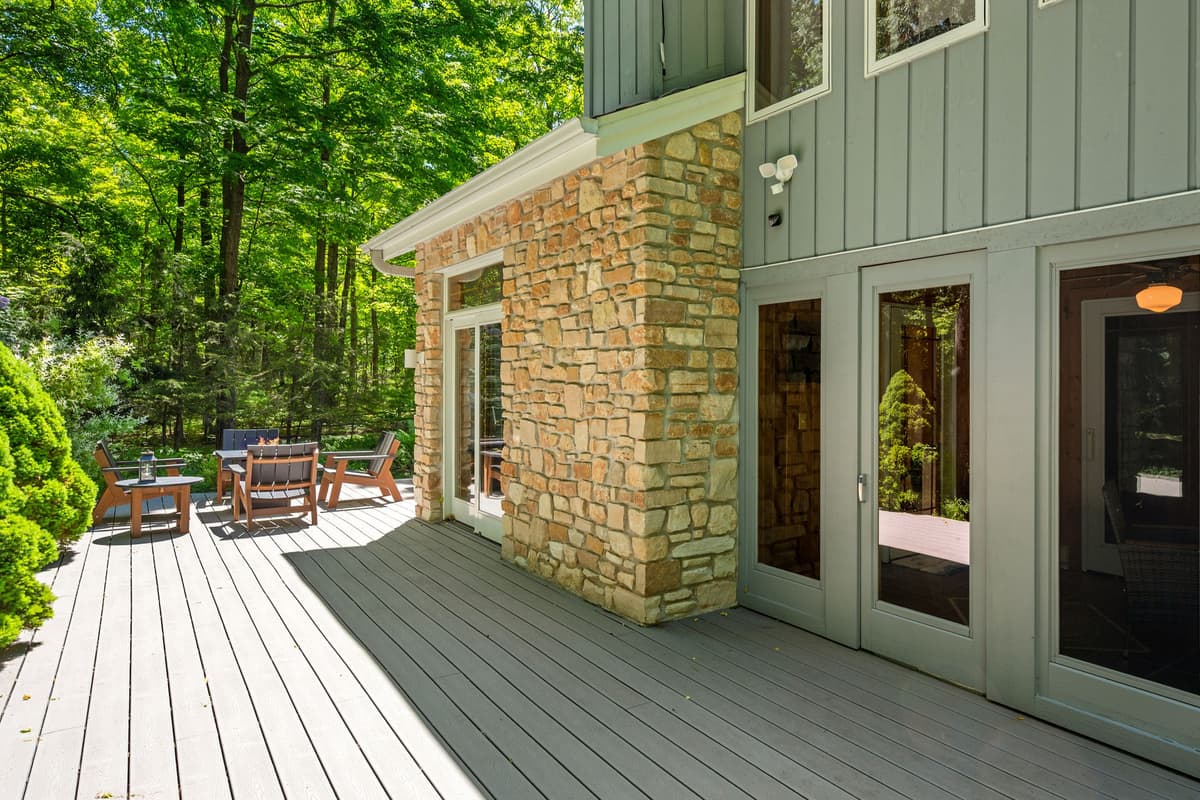 Step outside onto the spacious deck and take in the peaceful outdoor setting.