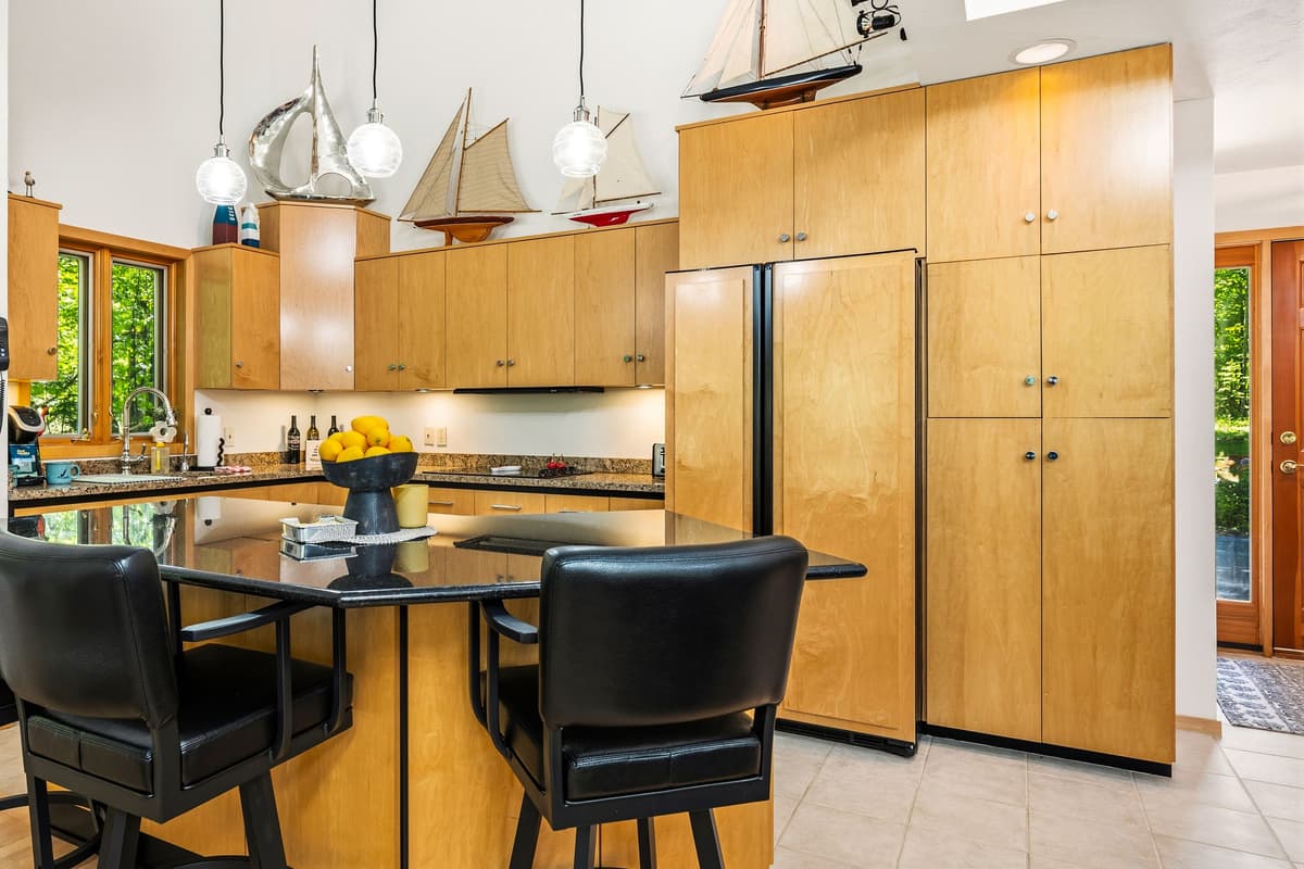 Kitchen island with comfortable seating, perfect for enjoying a quick breakfast, sipping coffee, or keeping the cook company while meals are prepared.